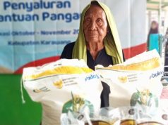 Pemdes Kertamukti Distribusikan Beras Bulog kepada 460 KPM 460 Warga Kertamukti Terima Bantuan Beras Bulog. (AlexaPodcast.ID)